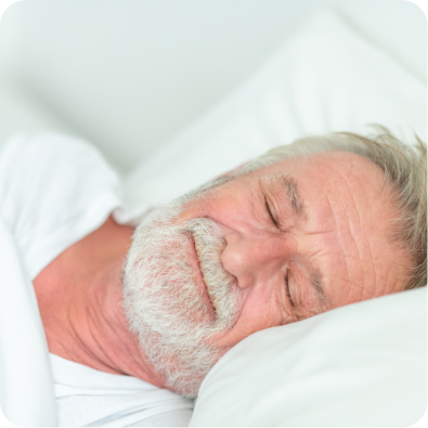 Older man sleeping without a CPAP unit